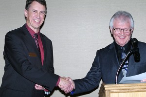 Cranbrook Mayor Wayne Stetski read the oath of office for Butler, right, and swore in the new board.