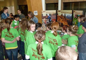 Students at the EK Science Fair gather to learn about worms and their role in composting from Wildsight's Jessica Windle.