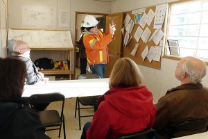 BC Hydro project coordinator Kerrie Huolt (standing) explains upgrades to Winsor Substation to (seated, left to right) Regional District of East Kootenay Electoral Area B Director Stan Doehle, Ktunaxa Nation representatives Marion Eunson and Diana Dearden, and Minister of Energy and Mines and Kootenay East MLA Bill Bennett, at a tour of the project in Elko on Monday, November 23.