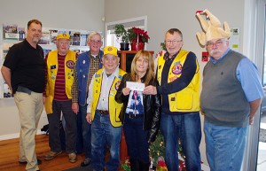 Cranbrook Lions Club members Curtis Bell, Jim Hong, Roger Selby and Bob Duthie presented $1,000 to the cause Dec. 3.