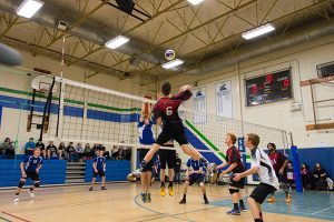 Dawson Atwood (jumping), of the senior boys' team in action.