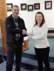 Director Gerry Drane presents the $3,000 Theresa Cundiff grant to Emily Smith of the Kimberley Arts Council for First Saturdays.